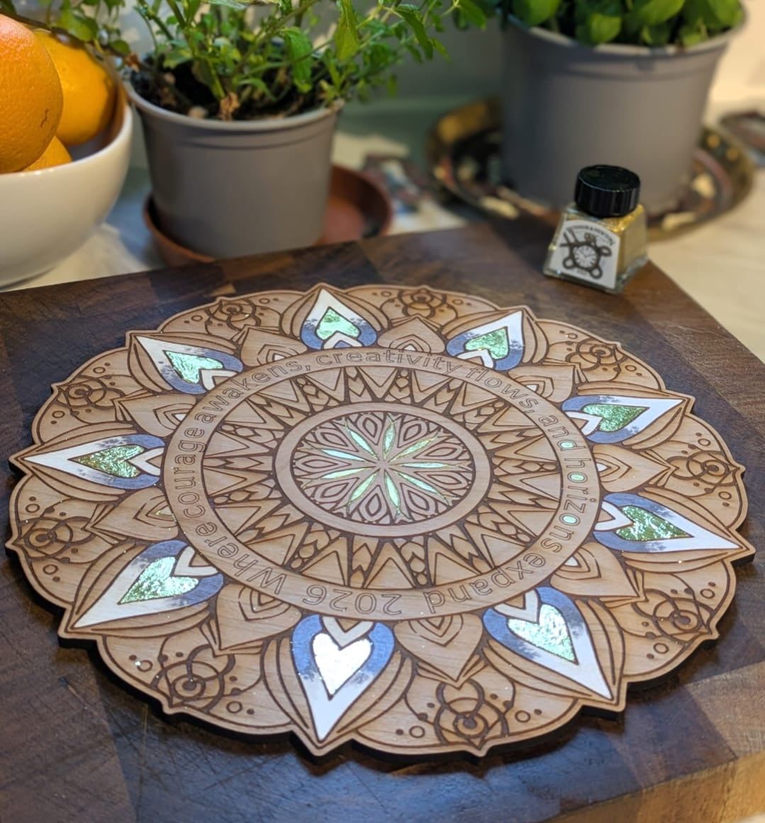 Gold leaf mandala in progress on natural wood â€” Amberlights workshop Norwich